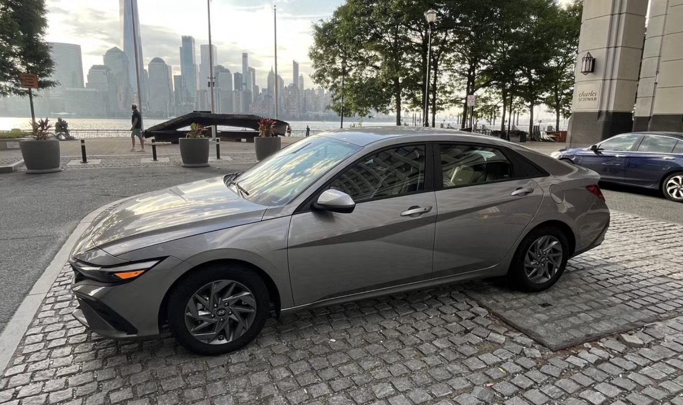 Hyundai Elantra parked at the Jersey City waterfront with the Manhattan skyline behind it